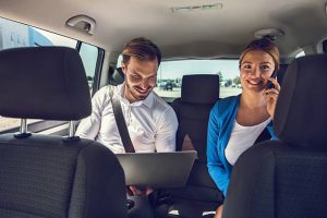 Services-couple enjoying Taxi Services from the airport