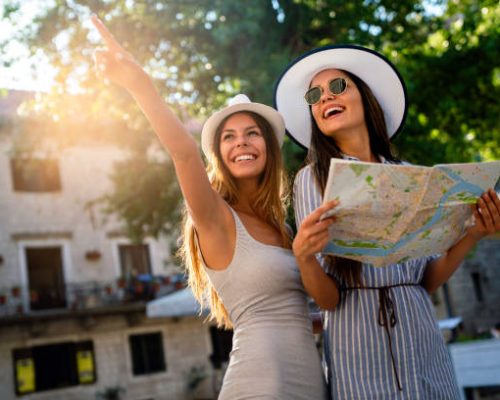 happy tourists with map aftr an airport transfer in kefalonia